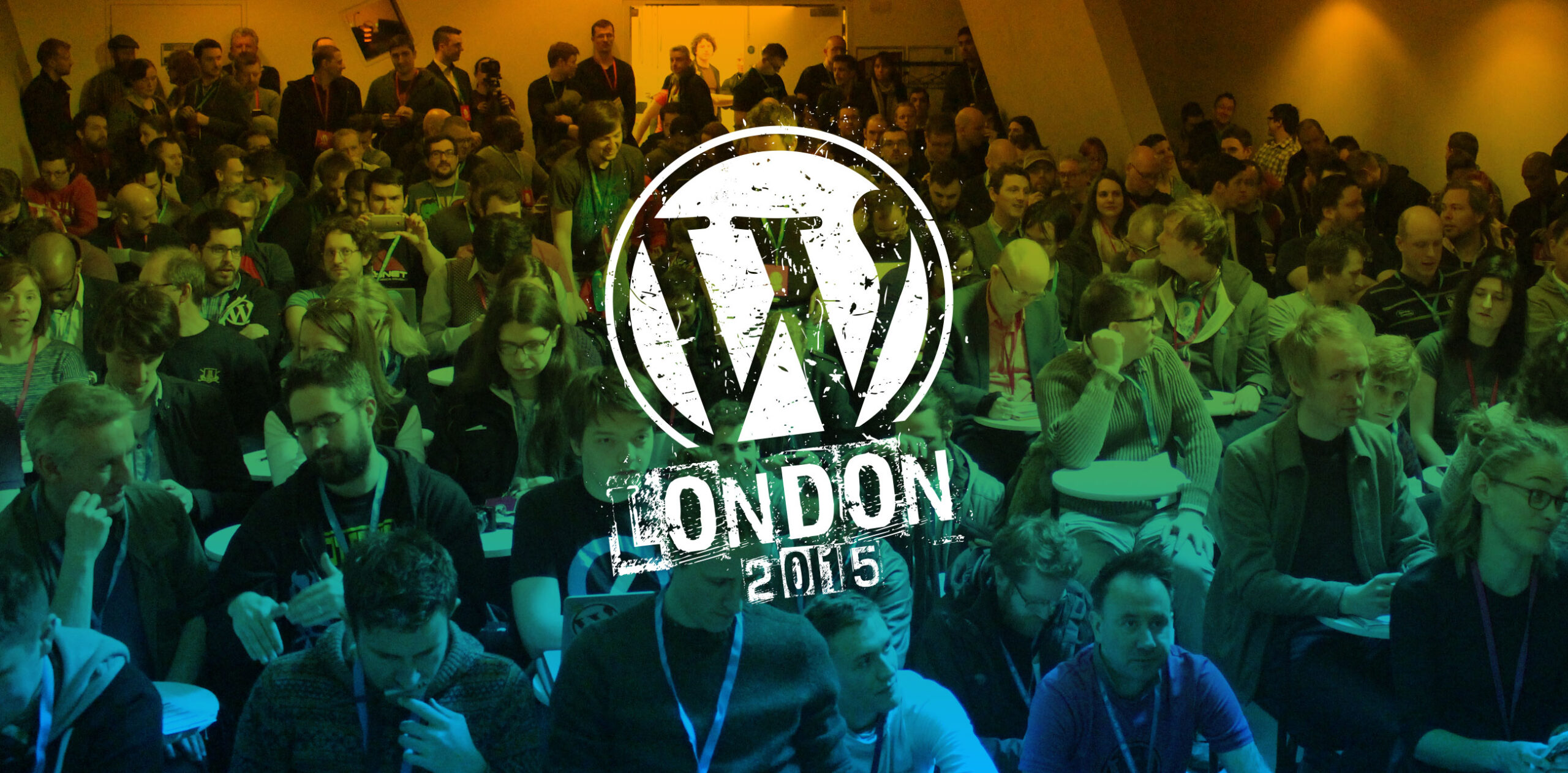WordCamp London Logo over a blue-green gradient photo of a crowd