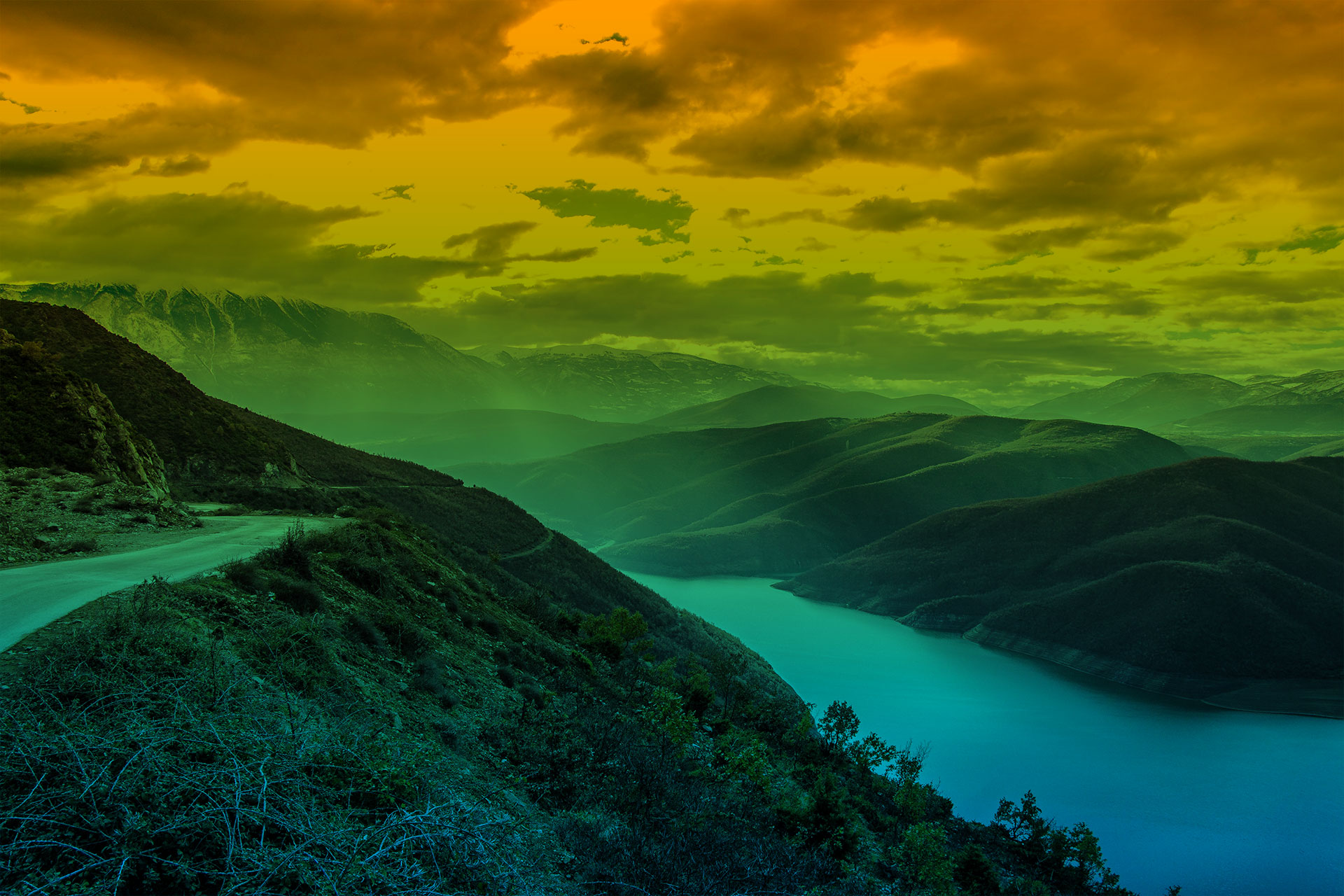photo of a road and river on a hillside with a green-blue gradient overlaid