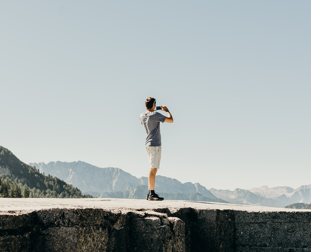 Case Study Cover Image -WeSwap - Man on a plateau with binoculars looking at mountains.