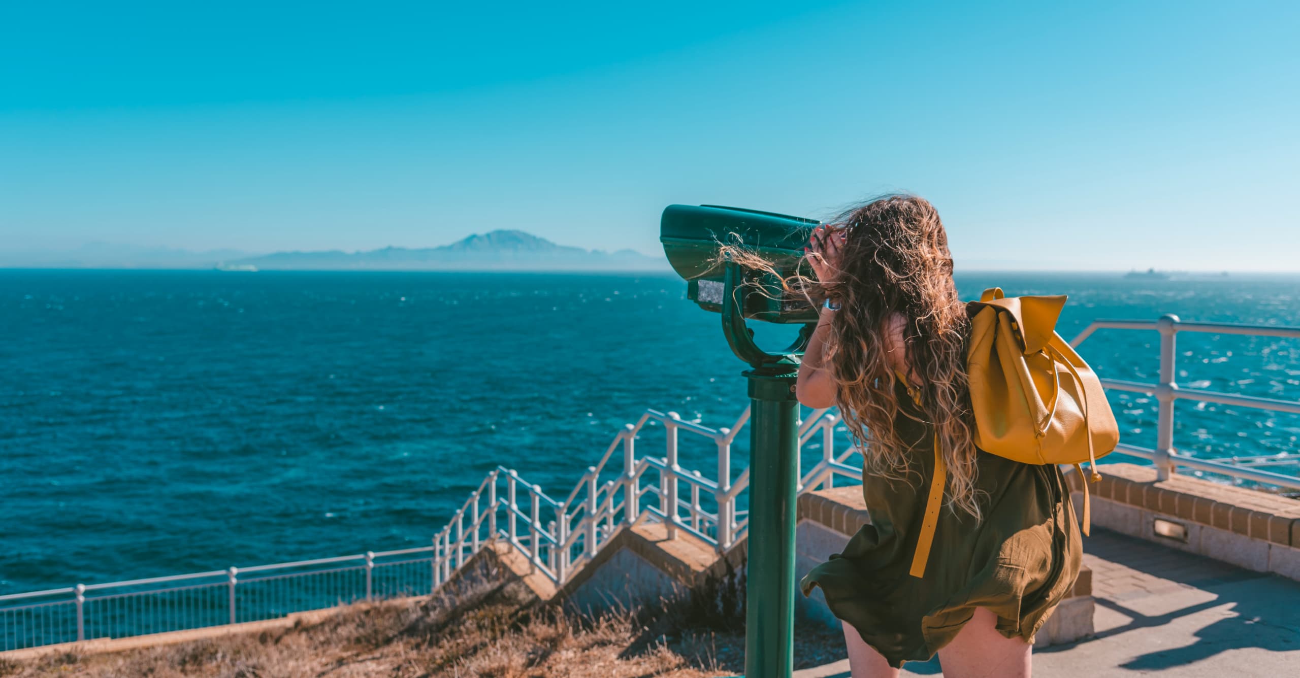 Cover art for Lets Go Do case study. woman looking at island from telescope