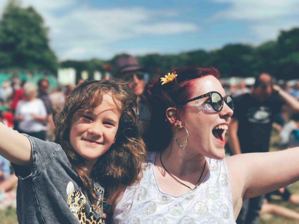 photo of a woman and a child enjoying a festival